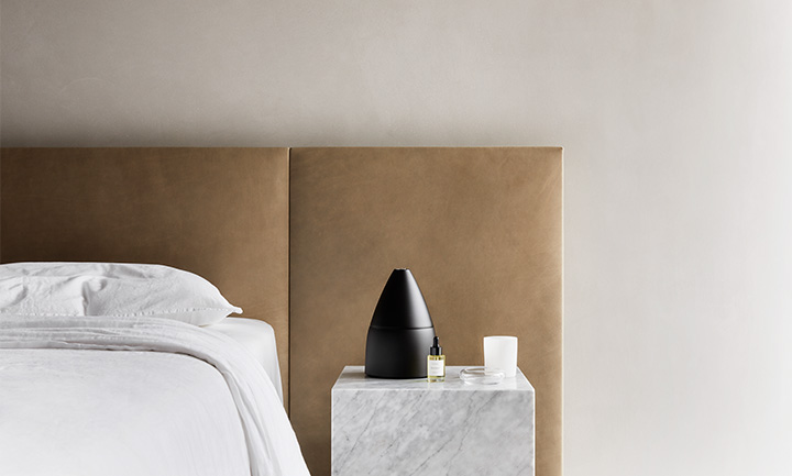 Black Aromax Scent Diffuser on Nightstand. Aromatherapy for Sleep