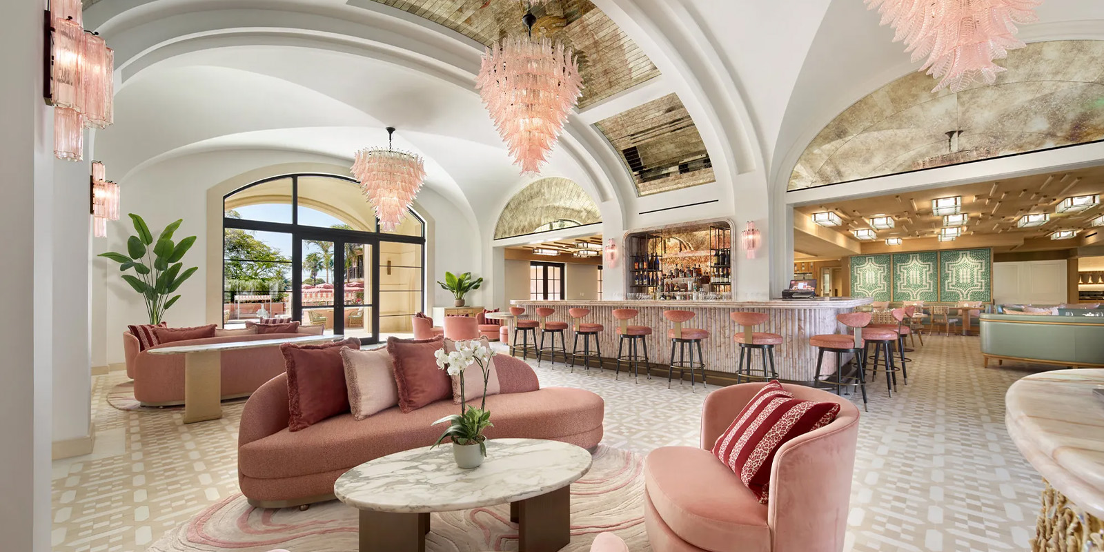 Palm House hotel scent interior with pink furniture and pink chandeliers